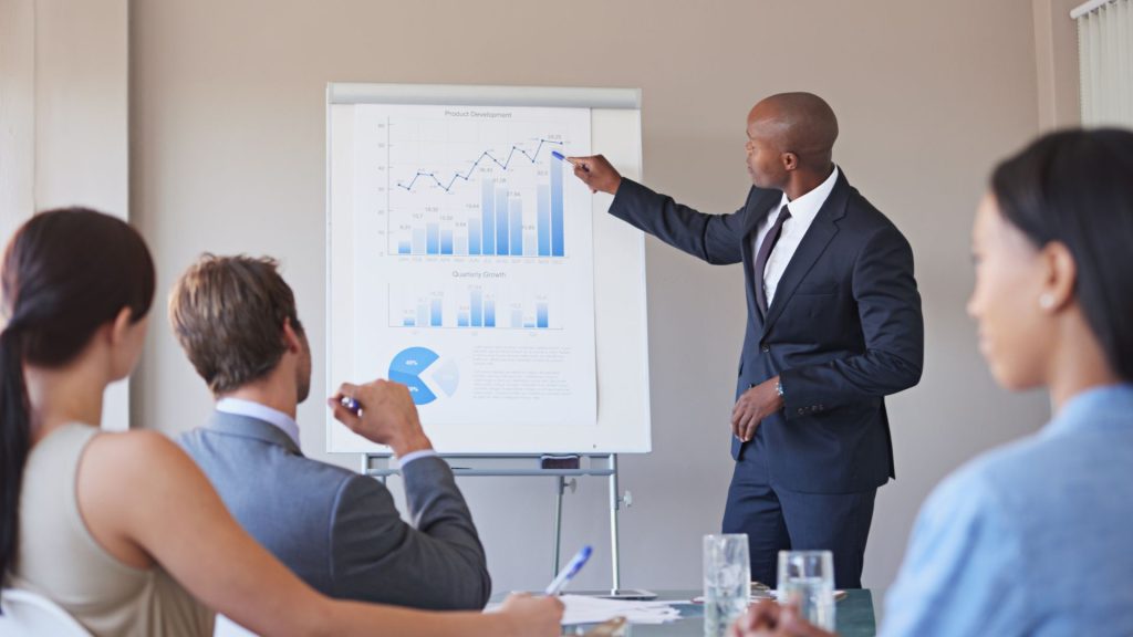 African leader presenting investment data