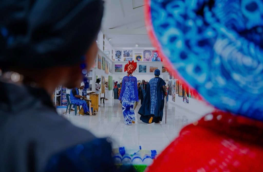 Visitors viewing African art in a cultural gallery